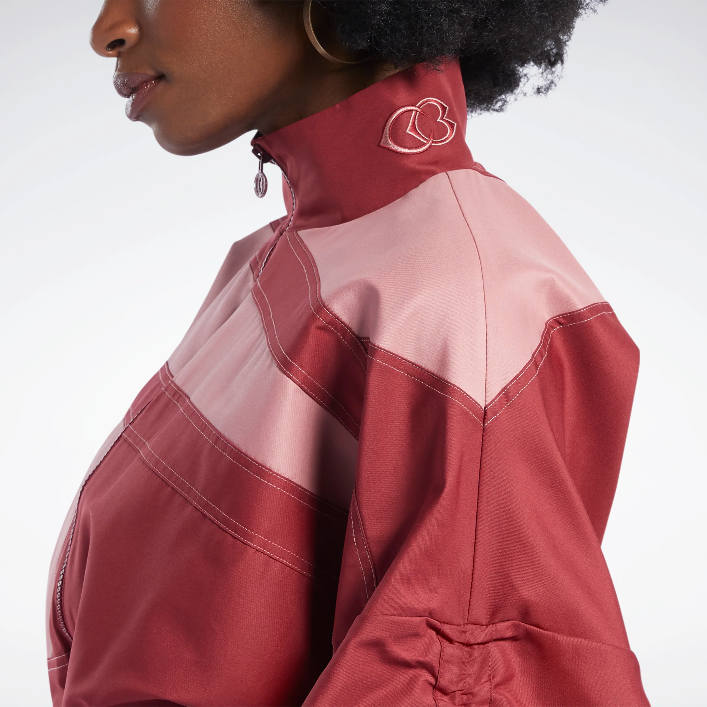 Reebok Apparel Women Cardi B Woven Satin Track Top Trired - Image 6